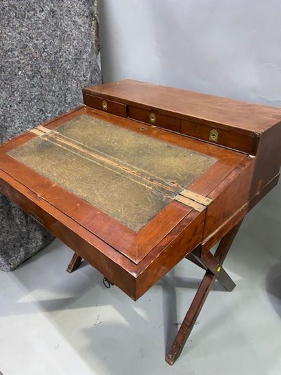 A mahogany and mahogany veneer travel desk
It...