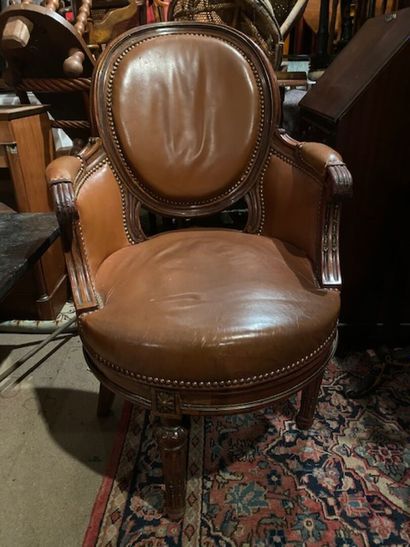 A mahogany and mahogany veneer swivel desk...