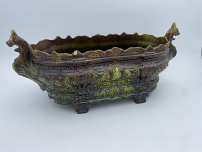 A barbotine jardinière with a brown and green...