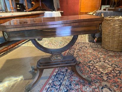 A mahogany and mahogany veneered dining table...