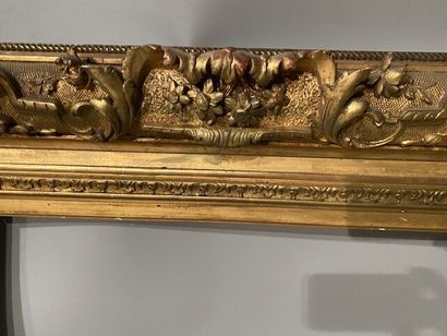 Gilded stuccoed wood frame decorated with...