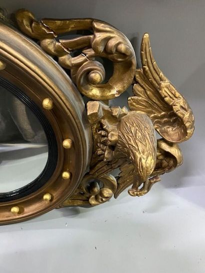 A witch mirror in stuccoed molded wood decorated...