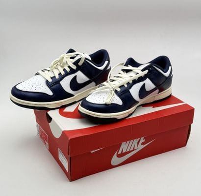 NIKE 
Pair of white and navy blue DUNK LOW...