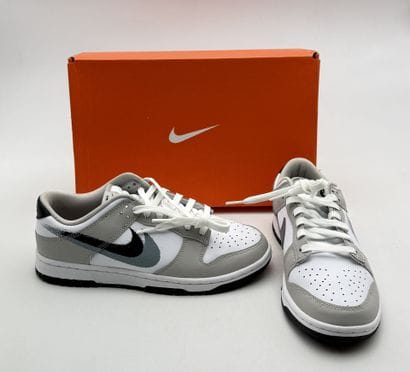 NIKE 
Pair of gray and white DUNK low-top...