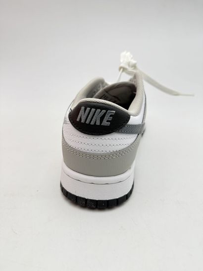 NIKE 
Pair of gray and white DUNK low-top...