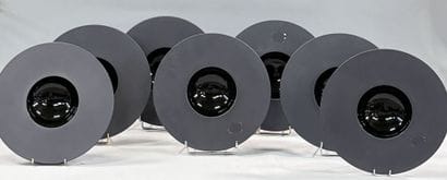 REVOL FRANCE 
Set of seven black porcelain...
