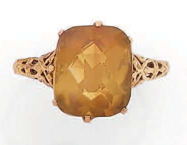 * Ring decorated with a citrine cut into...