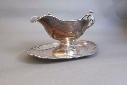 Silver shuttle sauce boat with two lateral...