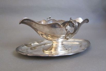 Silver shuttle sauce boat with two lateral...