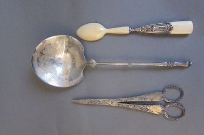 Silver strawberry spoon engraved with a frieze...