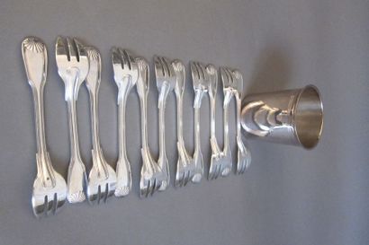 ERCUIS
Eleven silver plated metal cake forks...