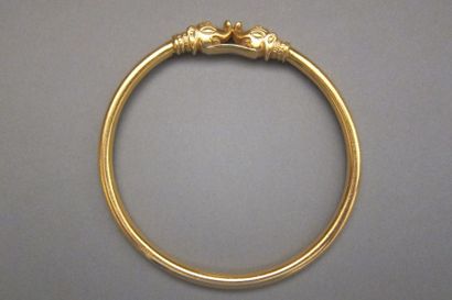 Rigid bracelet decorated with two elephant...