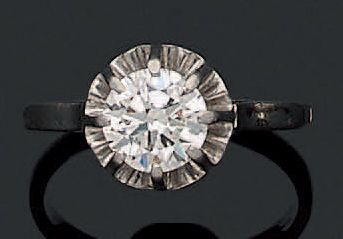 Solitaire ring in white gold 750‰ and platinum...
