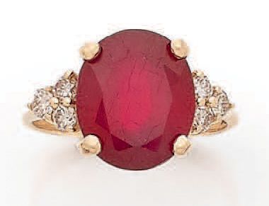 Ring decorated with an oval ruby probably...