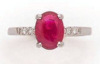 Ring decorated with an oval ruby between...