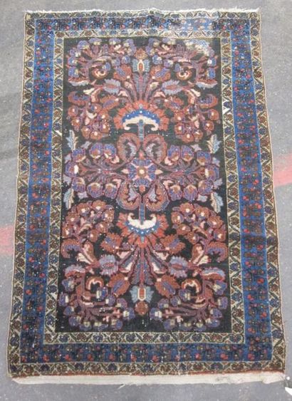 Lot de quatre tapis en laine, Iran début...