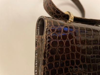 Jean PATOU

Sac en cuir marron façon reptile,...