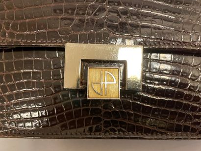 Jean PATOU

Sac en cuir marron façon reptile,...