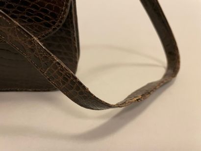Jean PATOU

Sac en cuir marron façon reptile,...