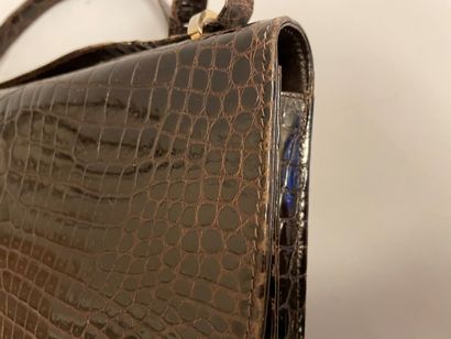 Jean PATOU

Sac en cuir marron façon reptile,...