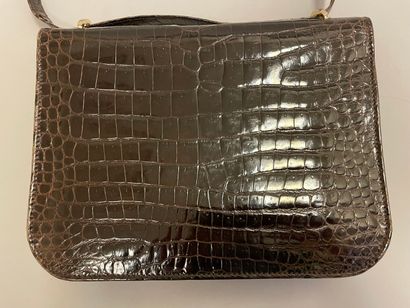 Jean PATOU

Sac en cuir marron façon reptile,...