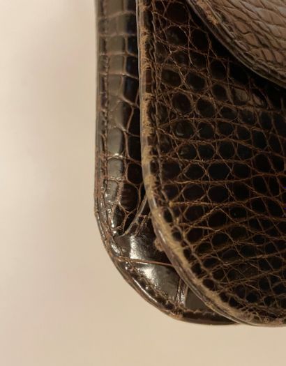 Jean PATOU

Sac en cuir marron façon reptile,...
