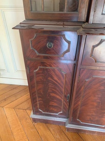 Mahogany bookcase, the upper part glazed,...