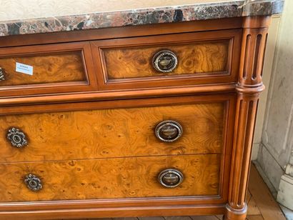 A burl veneer chest of drawers opening with...