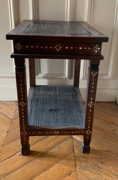 A veneer and mother of pearl inlaid saddle.

In...
