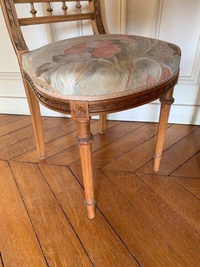 Two carved and molded wood chairs decorated...