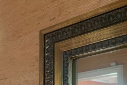 Rectangular mirror in carved and gilded wood...