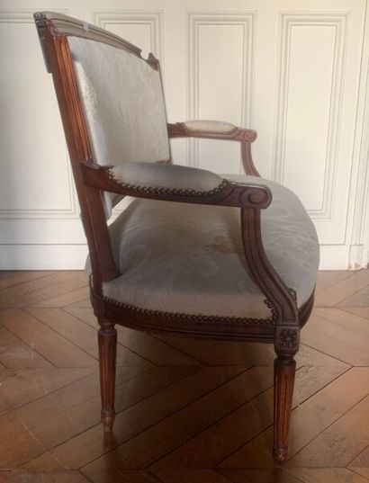 Molded stained wood sofa, the back in gendarme...
