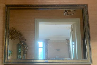 Rectangular mirror in carved and gilded wood...