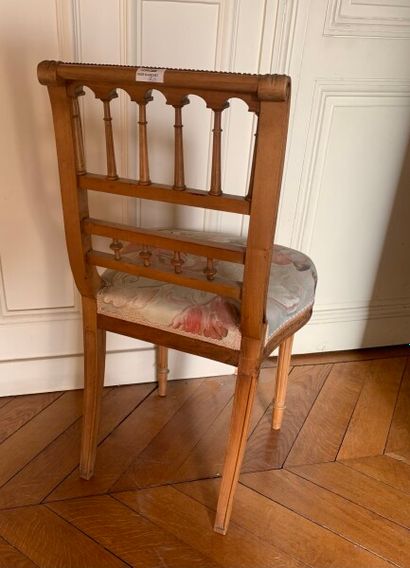 Two carved and molded wood chairs decorated...