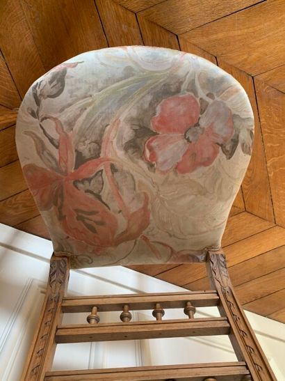 Two carved and molded wood chairs decorated...