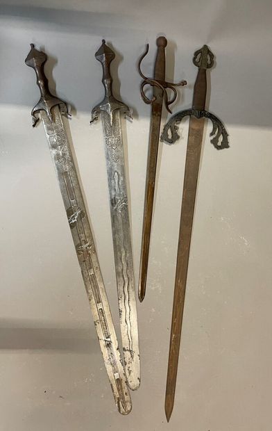 Set of four swords with chased decoration

Length...