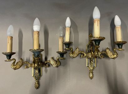A pair of ormolu sconces with three lights...