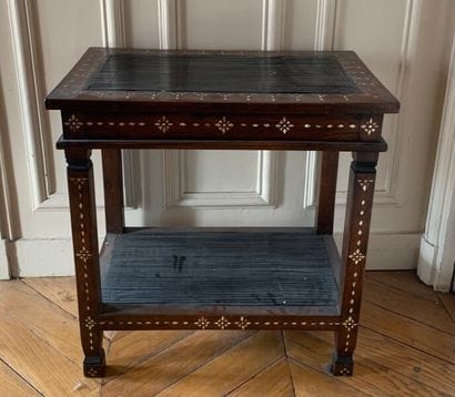 A veneer and mother of pearl inlaid saddle.

In...