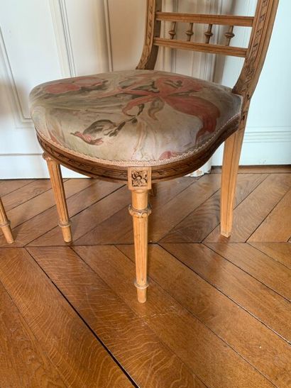 Two carved and molded wood chairs decorated...