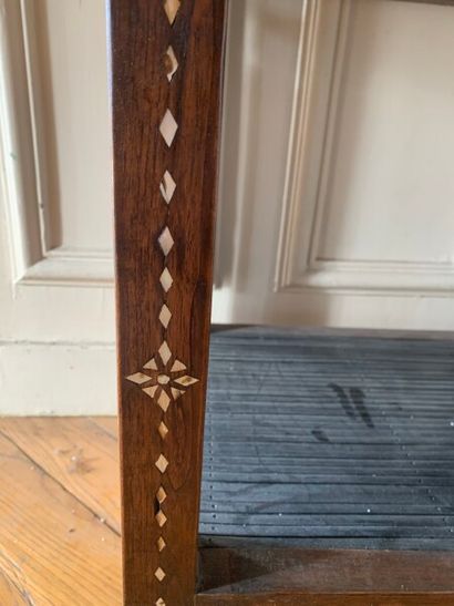 A veneer and mother of pearl inlaid saddle.

In...