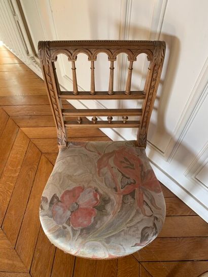 Two carved and molded wood chairs decorated...
