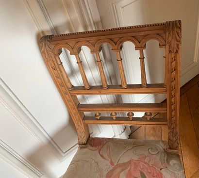 Two carved and molded wood chairs decorated...