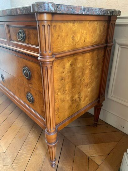 A burl veneer chest of drawers opening with...