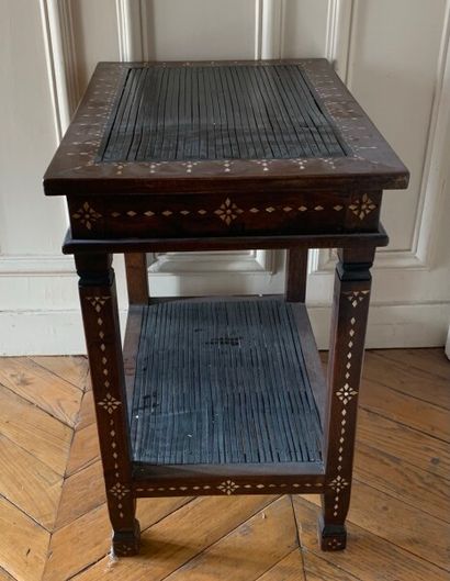 A veneer and mother of pearl inlaid saddle.

In...