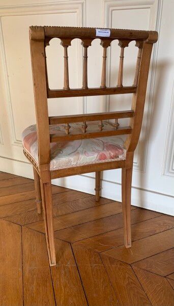 Two carved and molded wood chairs decorated...