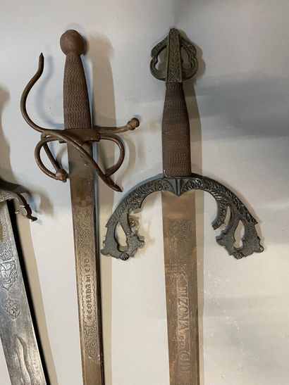 Set of four swords with chased decoration

Length...