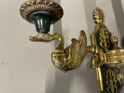 A pair of ormolu sconces with three lights...