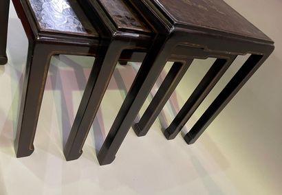 Three nesting tables in lacquer decorated...