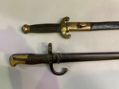 Saber and dagger with leather and brass scabbards
66...