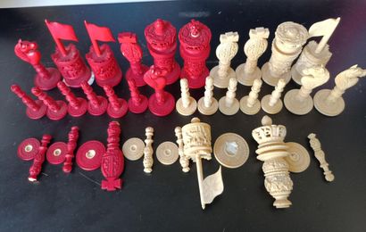 Carved and stained ivory chess set including...
